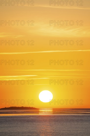 Picturesque, golden, magnificently beautiful sunset over the sea, Langlütjen II island far away,