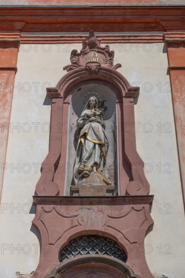 Sculpture of the Virgin Mary above the entrance portal of the baroque St Martin's Church, Riegel am