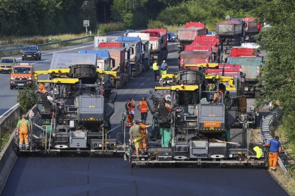 Essen, North Rhine-Westphalia, Germany, Road construction, Asphalt pavers and road rollers lay new,