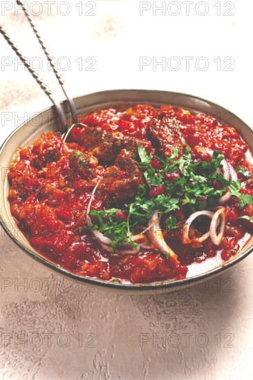 Chashushuli, a traditional Georgian dish, spicy, stewed meat with tomatoes and spices, homemade, no