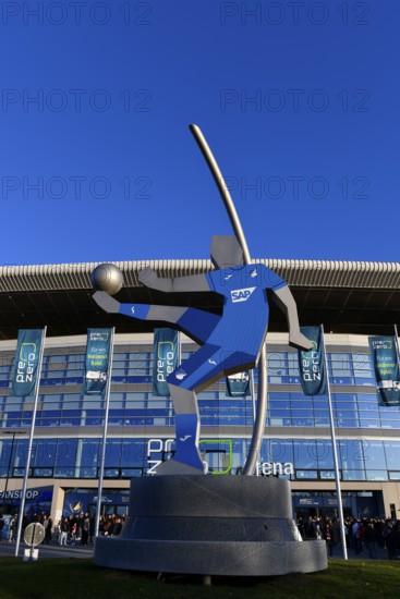 Exterior shot, statue, rotating football player with SAP advert on shirt, glass front, logo, main