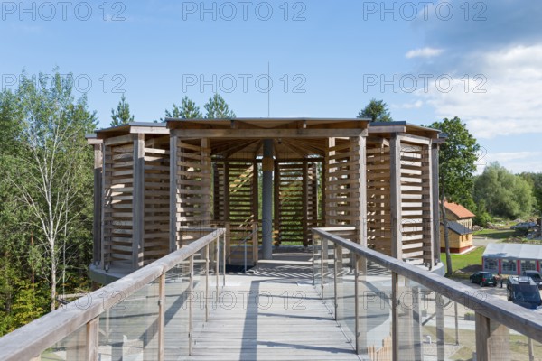 Wooden design building with glass railings and clear blue sky, modern style, observation tower,