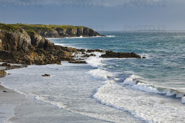 Waves breaking on the rocky coast near Plouarzel on the Atlantic coast, Département Finistère,