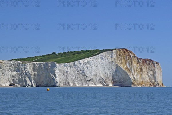 Majestic chalk cliffs above the blue sea under a clear sky, English Channel, Eastbourne, Sussex,