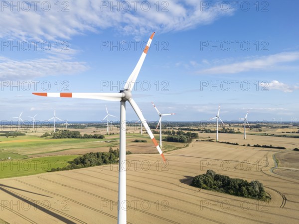 Wind turbine in a wind farm renewable energy wind power wind energy on the Baltic Sea aerial view