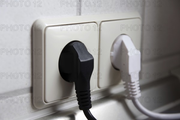 Double socket outlet, mains plug, black, white, electricity, household, Two different coloured