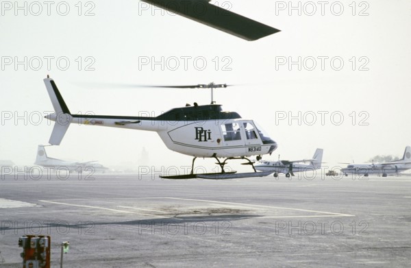 Oil industry in the Ras Tanura area, Saudi Arabia, Bell 206 JetRanger helicopter, 1979 PHI Inc