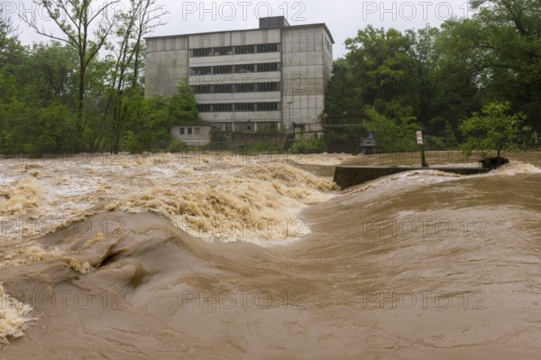 Symbolic image extreme weather, global warming, climate change, flood, flooded weir in Remseck an