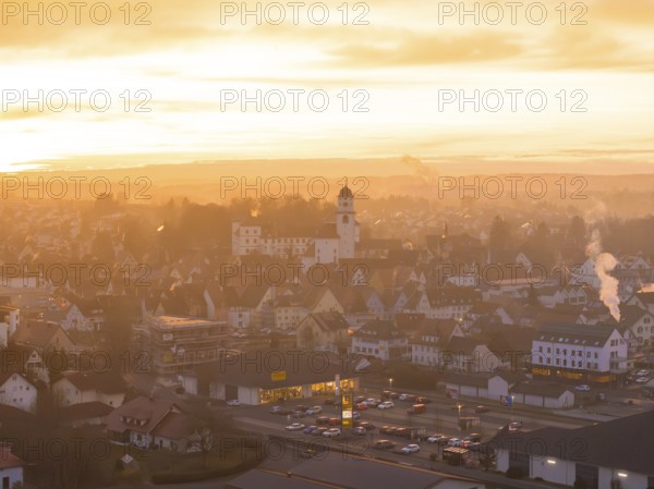 Panorama of a town at dusk, bathed in warm colours by the sunset, Meßkirch, Sigmaringen district,