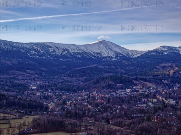 The town of Karpacz and the Giant Mountains with the Schneekoppe on a winter morning. Aerial photo.