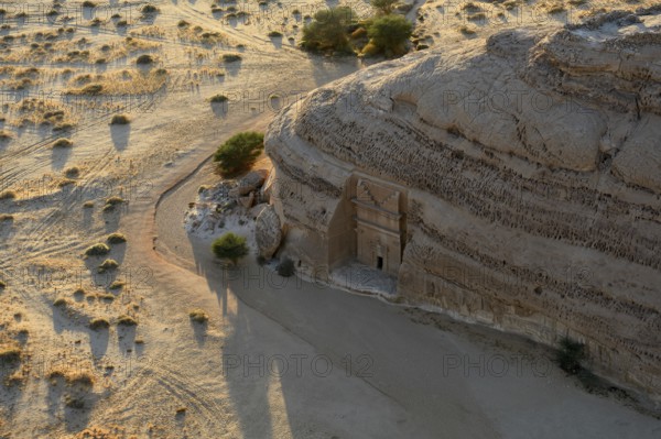 Nabataean tomb at the rock Qasr Al-Bint, blue hour, Hegra or Madain Salih, AlUla region, Medina