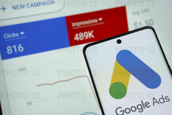Google Ads logo is displayed on a smartphone screen, with a stock graph webpage visible on a