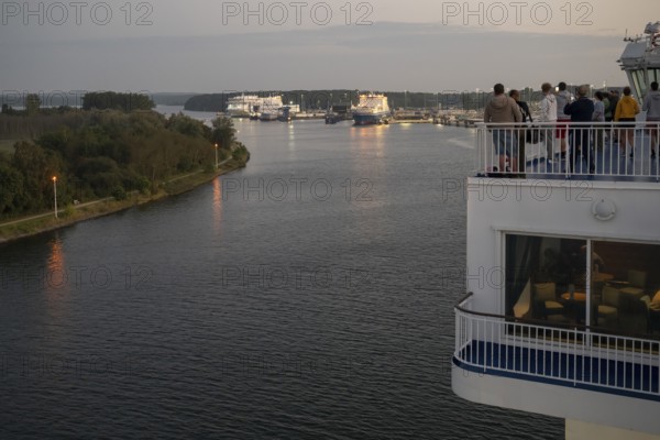 Travellers follow the Finnish ferry entering the port of Travemünde, Bay of Lübeck, Lübeck,