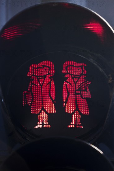 Pedestrian traffic light with red Brothers Grimm Ampelmännchen, Hanau, birthplace of the brothers,