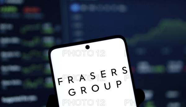 Frasers group logo is displayed on smartphone. Frasers Group plc is a British retail, sport and
