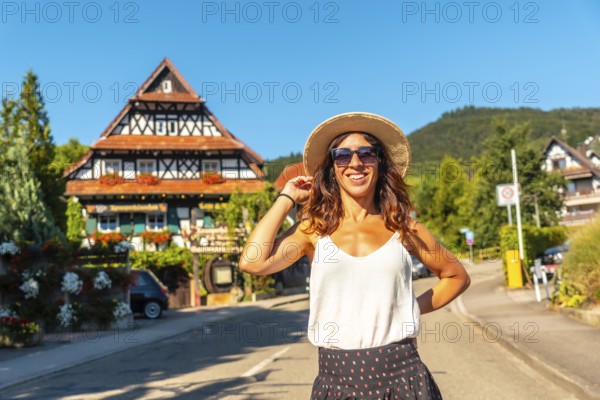 Portrait of a female tourist in the medieval mountain village of Sasbachwalden, Black Forest,