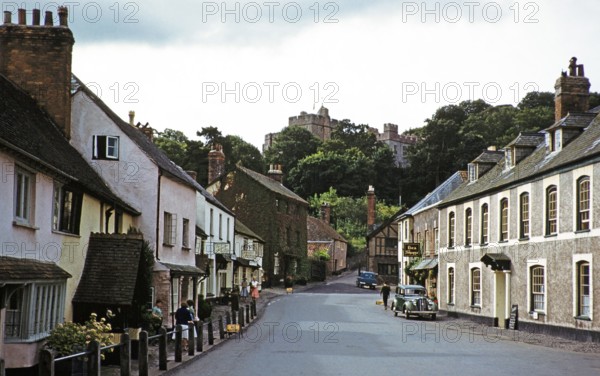 Dunster Castle and historic buildings, main street of the village, High Street, Dunster, Somerset,