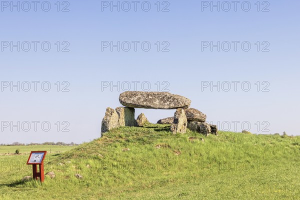 Passage grave on a hill with big boulders in a rural landscape with a clear blue sky Falköping,