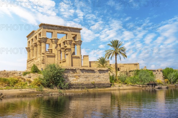 The beautiful temple of Philae and the Greco-Roman buildings seen from the Nile river, a temple
