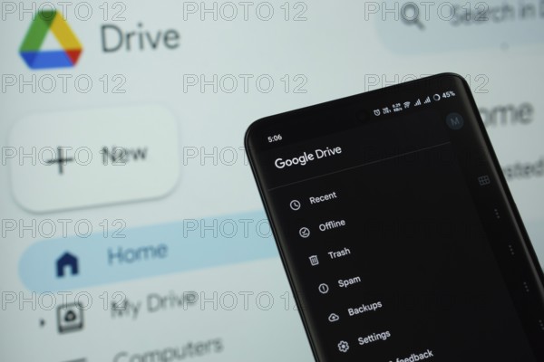 The app of the google drive is displayed on a smartphone screen, and the website google drive is