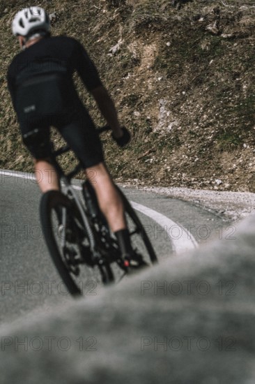 Road bike rider in spring between Lechtal and Tannheimer Tal in front of picturesque scenery of the