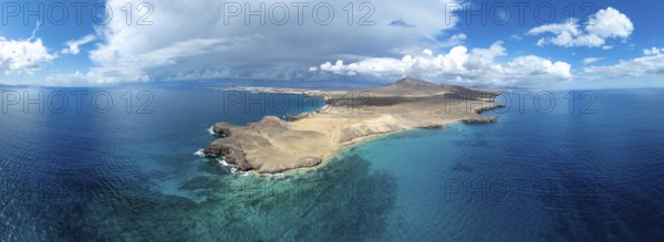 Headland and blue sea, coastal landscape, arid landscape of Los Ajaches Natural Park, aerial view,