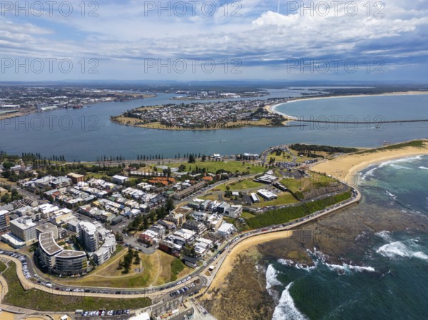 A breathtaking aerial view of Newcastle, New South Wales, showcasing the stunning coastline, urban