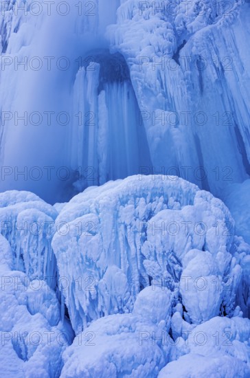 Urach waterfall full of bizarre ice formations frozen at winter temperatures, Bad Urach, Swabian