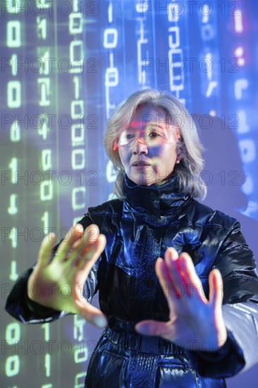 An elderly Asian woman engages with the metaverse using virtual reality technology. She wears