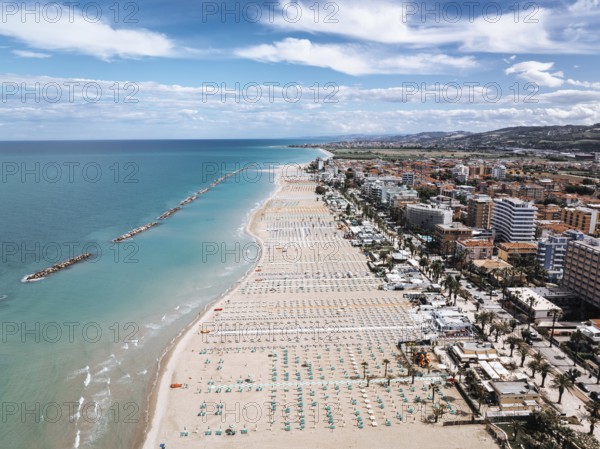 Stunning aerial shot of San Benedetto, Italy, showcasing its expansive sandy beaches, vibrant