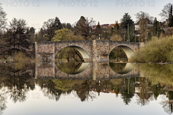 Stone bridge reflected in the calm water with surrounding nature, The historic Bartenwetz stone