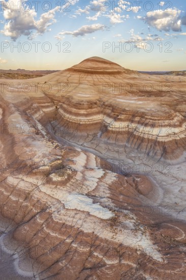 Stunning aerial shot capturing the intricate layers and rolling hills of bentonite clay in Utah's