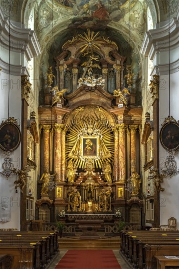 Altar of the baroque parish church Mariahilfer Kirche in Vienna, Austria