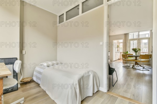 A serene living space showcasing a minimalist design with soft lighting, wooden floors, and a