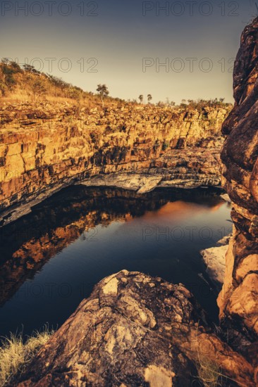Bell Gorge waterfall, a body of water in north-west Australia in the Kimberley. Sunrise in the