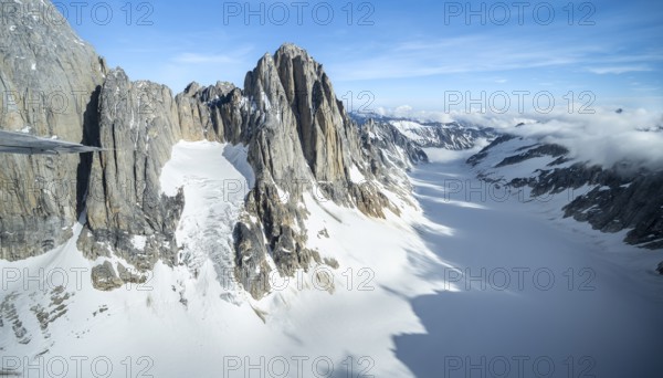 Cliffs, Kichatna Spires, snow and ice, epic mountains with glaciers, aerial view, Alaska Range,