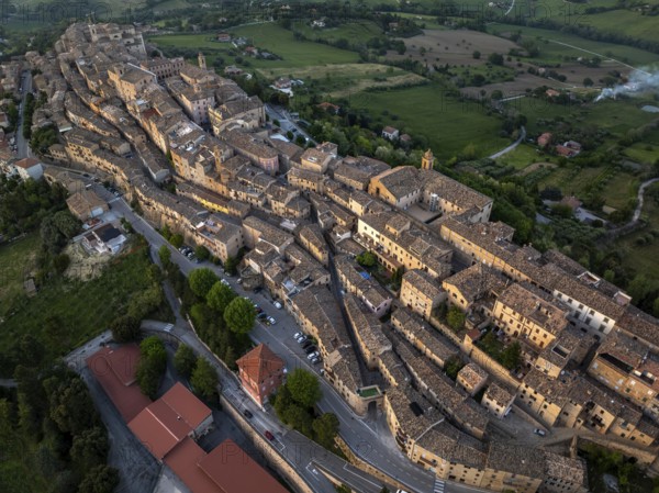 Aerial view of Treia, Italy, highlighting its remarkable medieval architecture nestled amid lush