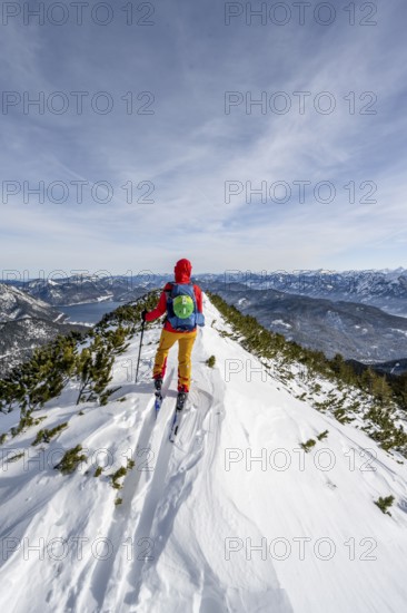 Ski tourer at the summit of Simetsberg, mountain panorama, Estergebirge, Bavarian Prealps, Bavaria