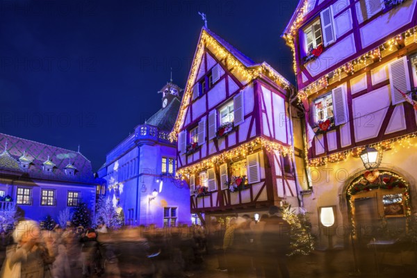 Colourfully illuminated and Christmassy decorated half-timbered houses, old town, blue hour,