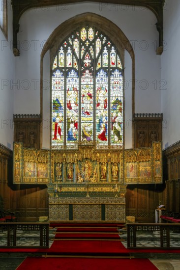 Stained glass east window, elaborately carved gilt altar reredos screen 1938, church of Saint John
