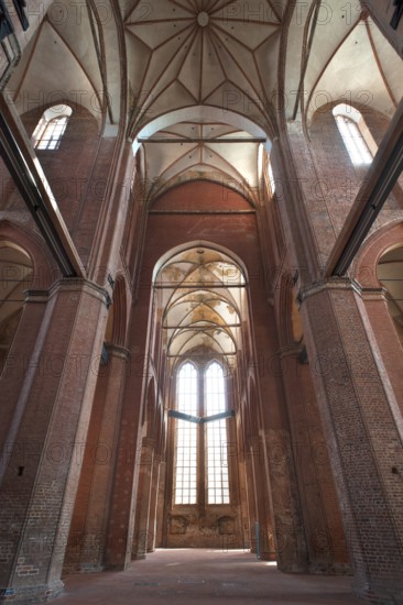 Empty interior of St Georgen, Gothic brick building of the 14th century, under reconstruction,