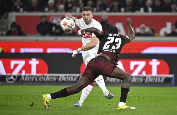 Duel, action Ermedin Demirovic VfB Stuttgart (09) against Castello Lukeba RasenBallsport RB Leipzig