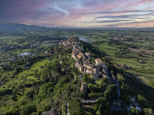 Aerial view of Treia, Italy, capturing the historic architecture and lush countryside under a