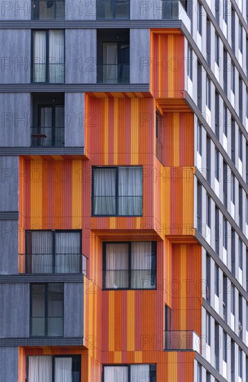 Detail of modern architecture blending glass, concrete, and metal in a suburb high-rise building,