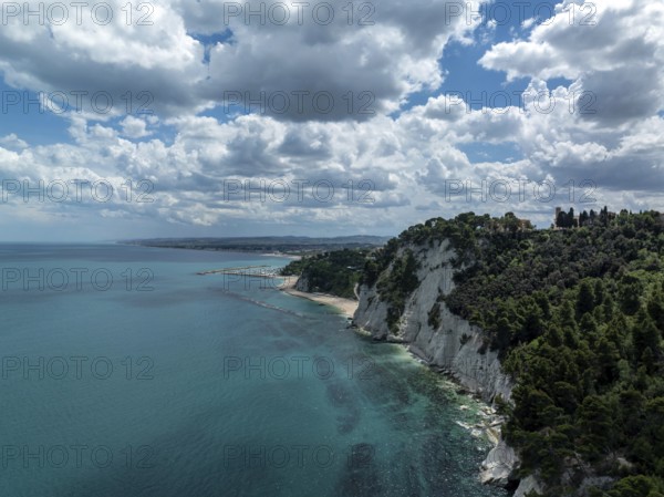 Aerial view of the stunning coastline in Sirolo, Italy. Dramatic cliffs rise from the turquoise
