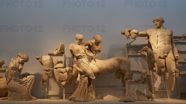 On the right, the god Apollo, west pediment of the Temple of Zeus, battle between lapiths and