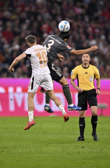 Florian Wirtz Bayer 04 Leverkusen (10) v Min-jae Kim FC Bayern Munich FCB (03) Referee Referee