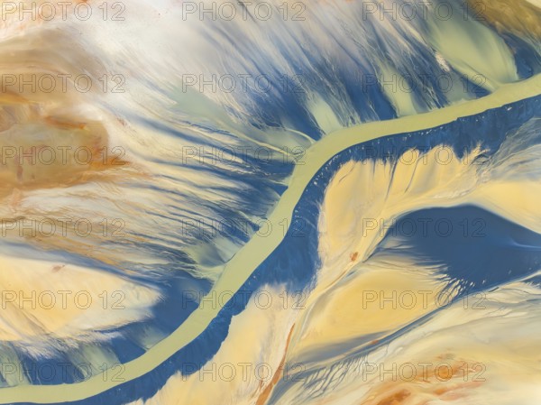 From above, this striking aerial shot captures vibrant natural textures and a sinuous river amidst