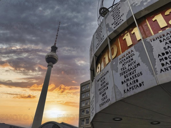 Dramatic sunset with the Berlin TV Tower and the Berlin World Clock in the foreground,