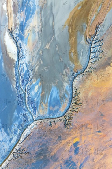 Abstract fractal work featuring dynamic patterns in vibrant blues, oranges, and earth tones. The